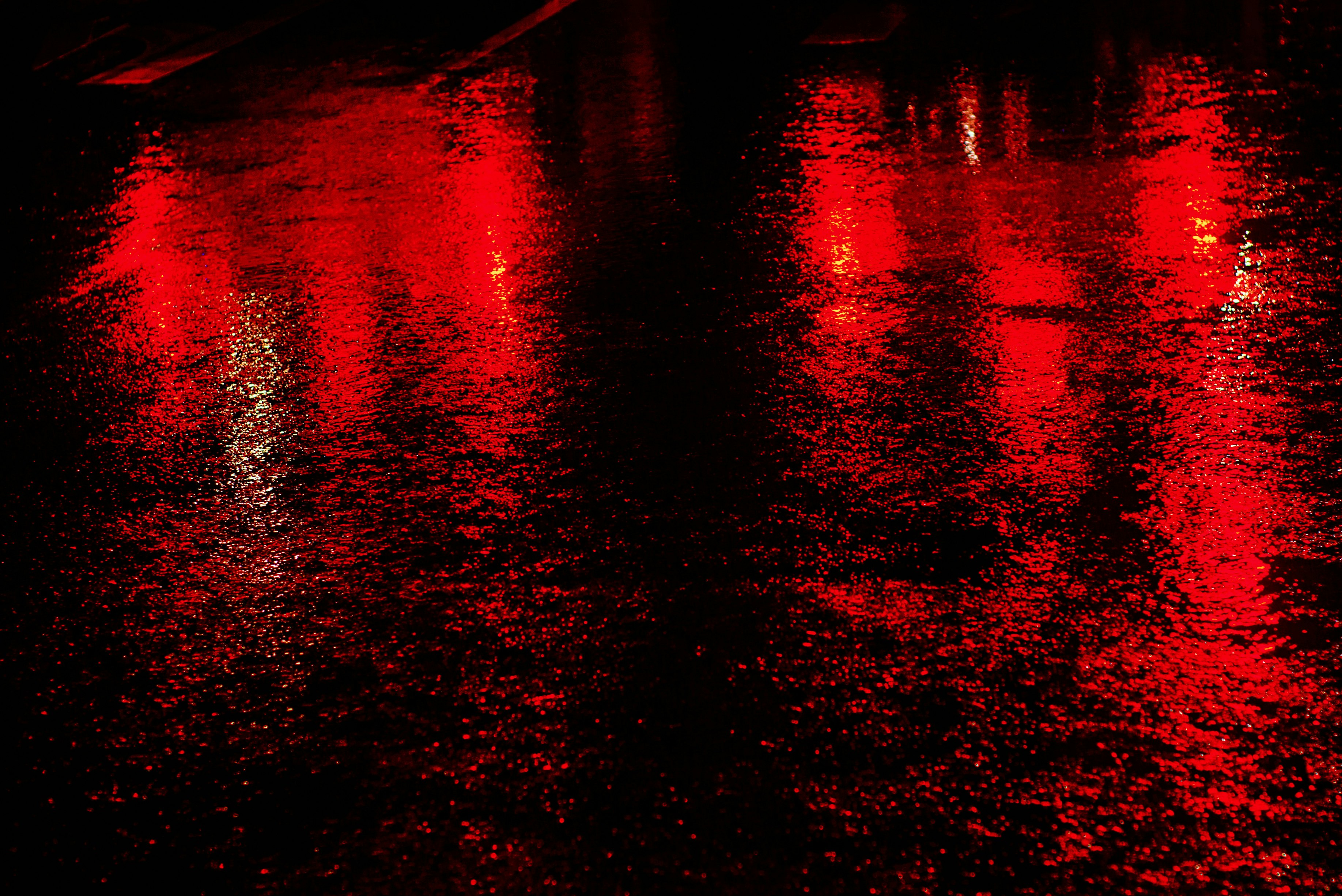 red and black body of water during night time